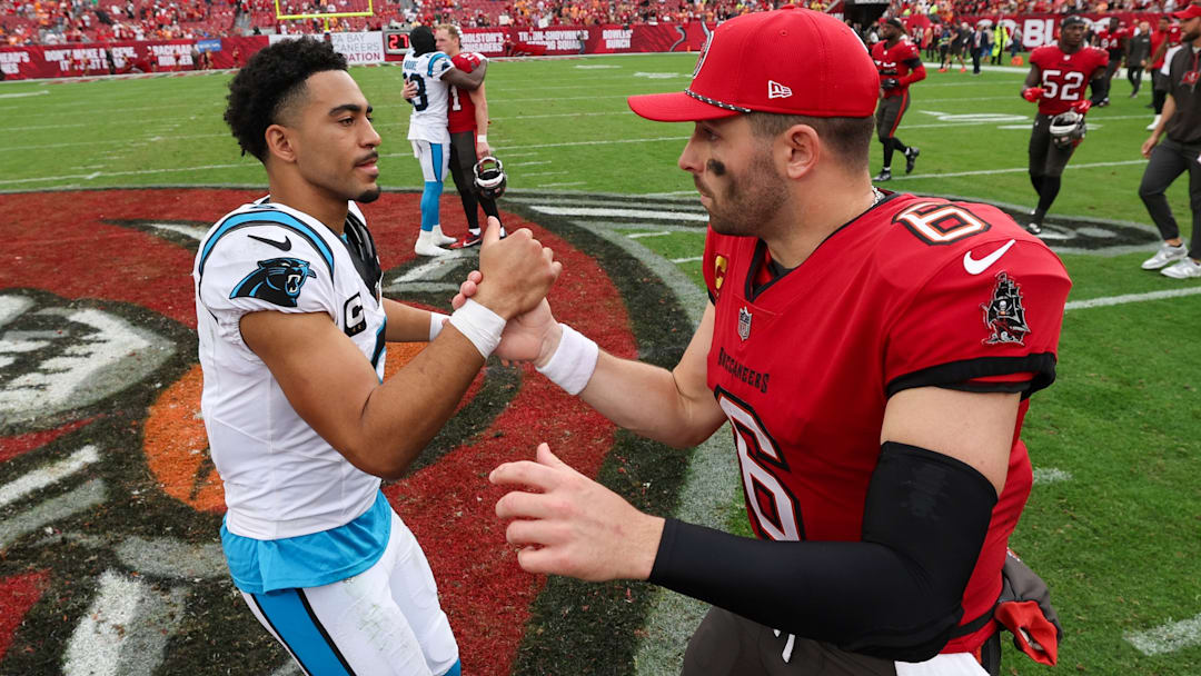 Dec 29, 2024; Tampa, Florida, USA; Tampa Bay Buccaneers quarterback Baker Mayfield (6) great Carolina Panthers quarterback Bryce Young (9) after a game at Raymond James Stadium.