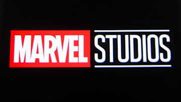 In this photo illustration a Marvel Studios logo is seen on...