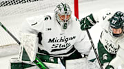 Michigan State's Trey Augustine, left, guards the goal against Minnesota during the first period on Saturday, Jan. 25, 2025, at Munn Arena in East Lansing.