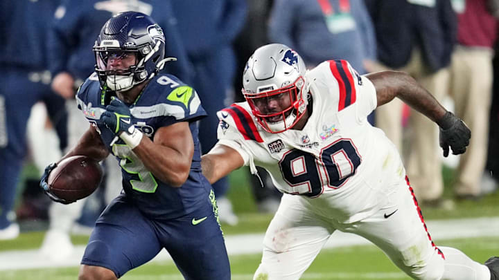 Feb 8, 2026; Santa Clara, CA, USA; Seattle Seahawks running back Kenneth Walker III (9) runs the ball as New England Patriots defensive tackle Christian Barmore (90) defends during the third quarter in Super Bowl LX at Levi's Stadium. Mandatory Credit: Cary Edmondson-Imagn Images
