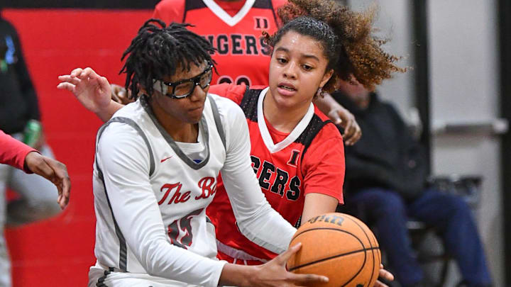 Jaida Civil of Palm Bay collides with Tony ah Boggs of Dunnellon in the Class 4A girls basketball regional semifinal Monday, February 19, 2024. Craig Bailey/FLORIDA TODAY via USA TODAY NETWORK Jaida Civil of Palm Bay collides with Tony ah Boggs of Dunnellon in the Class 4A girls basketball regional semifinal Monday, February 19, 2024. Craig Bailey/FLORIDA TODAY via USA TODAY NETWORK