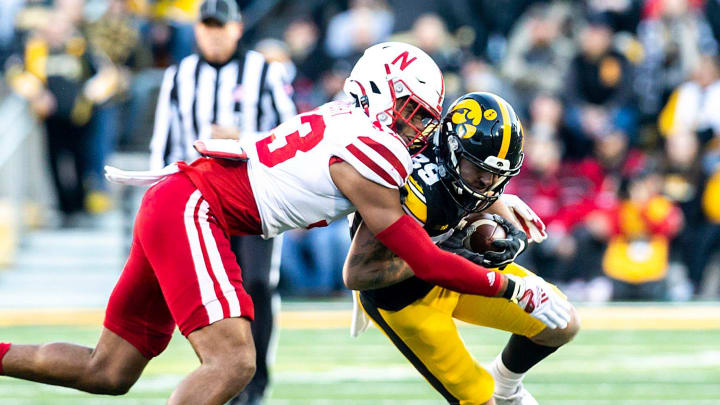 Iowa wide receiver Nico Ragaini, right, gets tackled by Nebraska's Javin Wright during a NCAA Big Ten Conference football game, Friday, Nov. 25, 2022, at Kinnick Stadium in Iowa City, Iowa.