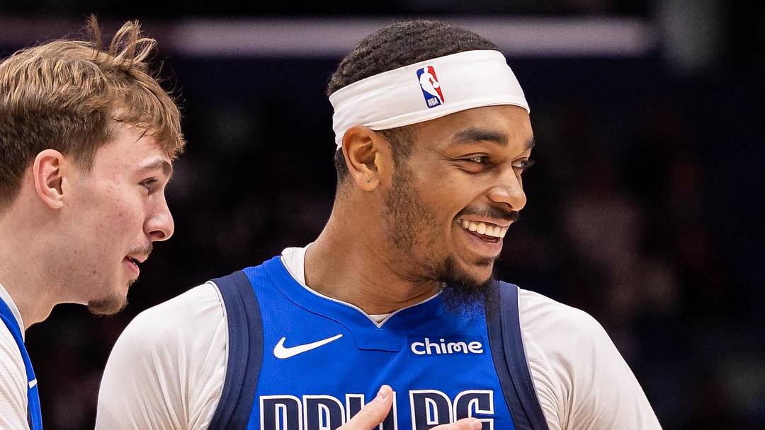 Mar 16, 2026; New Orleans, Louisiana, USA;  Dallas Mavericks forward Cooper Flagg (32) shares a moment with forward P.J. Washington (25) against the New Orleans Pelicans during the first half at Smoothie King Center. Mandatory Credit: Stephen Lew-Imagn Images