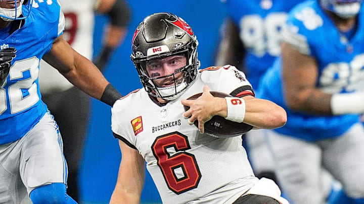 Tampa Bay Buccaneers quarterback Baker Mayfield (6) slides for a first down against Detroit Lions during the first half at Ford Field in Detroit on Sunday, September 15, 2024.