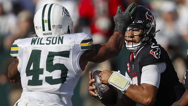 Texans QB C.J. Stroud takes a sack against the Packers
