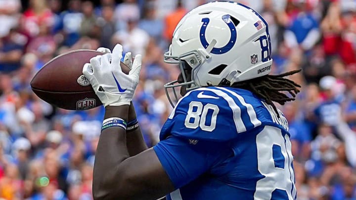 Indianapolis Colts tight end Jelani Woods (80) catches a touchdown pass while being guarded by Kansas City Chiefs safety Juan Thornhill (22) on Sunday, Sept. 25, 2022, during a game against the Kansas City Chiefs at Lucas Oil Stadium in Indianapolis.