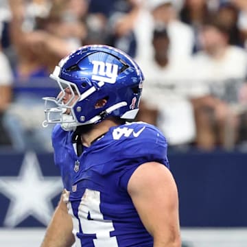 Sep 14, 2025; Arlington, Texas, USA; New York Giants running back Cam Skattebo (44) reacts after scoring a touchdown against the Dallas Cowboys during the fourth quarter at AT&T Stadium.  