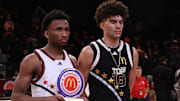 Apr 1, 2025; Brooklyn, NY, USA; McDonald's All American West guard Darryn Peterson (22) and McDonald's All American East forward Cameron Boozer (12) pose for photos after the game at Barclays Center. Mandatory Credit: Pamela Smith-Imagn Images