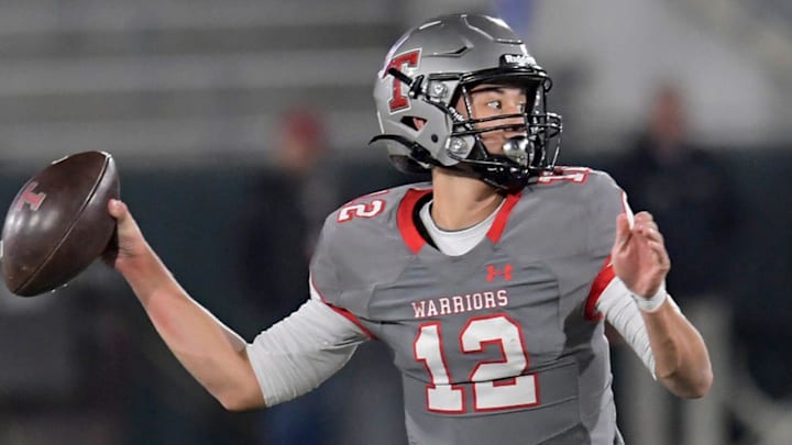 Thompson four-star junior quarterback Trent Seaborn (12) bounced back from an early interception on a deflected pass and led his Warriors to 31-unanswered points in the second half.