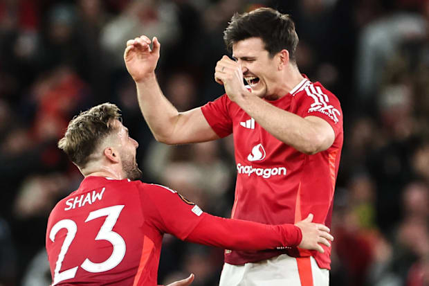 Luke Shaw celebrates with Harry Maguire