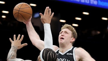 Dec 1, 2025; Brooklyn, New York, USA; Brooklyn Nets forward Danny Wolf (2) dunks against Charlotte Hornets forward Miles Bridges (0) during the fourth quarter at Barclays Center. Mandatory Credit: Brad Penner-Imagn Images