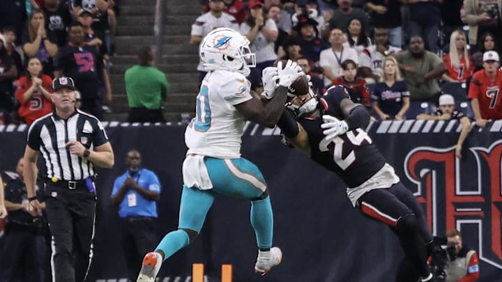 Houston Texans cornerback Derek Stingley intercepts the ball against Miami Dolphins wide receiver Tyreek Hill in an NFL game Houston Texans cornerback Derek Stingley intercepts the ball against Miami Dolphins wide receiver Tyreek Hill in an NFL game