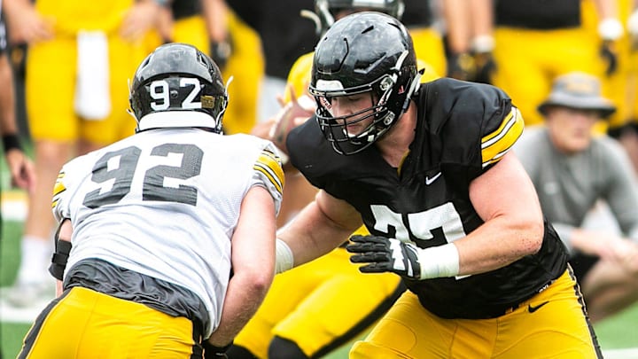 Iowa offensive lineman Connor Colby (77) blocks against defensive lineman John Waggoner (92) during the Kids Day at Kinnick NCAA football practice, Saturday, Aug. 13, 2022, at Kinnick Stadium in Iowa City, Iowa.

220813 Ia Kids Day Fb 082 Jpg