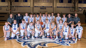 Once an Eagle, always an Eagle. Coach Blank (top left) keeps his school pride close to his heart and hoops. 