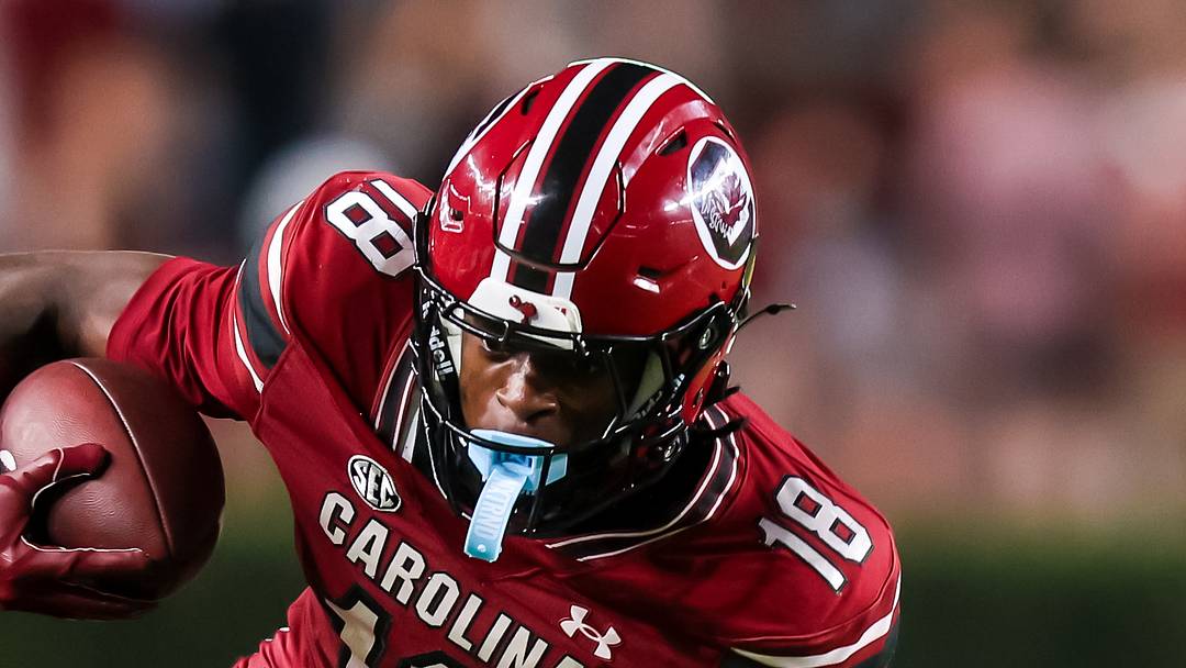 Nov 22, 2025; Columbia, South Carolina, USA; South Carolina Gamecocks wide receiver Brian Rowe Jr. (18) gets around Coastal Carolina Chanticleers cornerback Chris Henry (17) in the second half at Williams-Brice Stadium. Mandatory Credit: Jeff Blake-Imagn Images