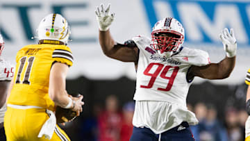 South Alabama Jaguars defensive lineman Wy'Kevious Thomas (99) pressures Western Michigan Broncos quarterback Hayden Wolff (11) as South Alabama takes on Western Michigan during the IS4S Salute to Veterans Bowl at Cramton Bowl in Montgomery, Ala., on Saturday, Dec. 14, 2024. South Alabama Jaguars lead Western Michigan Broncos 16-13 at halftime.