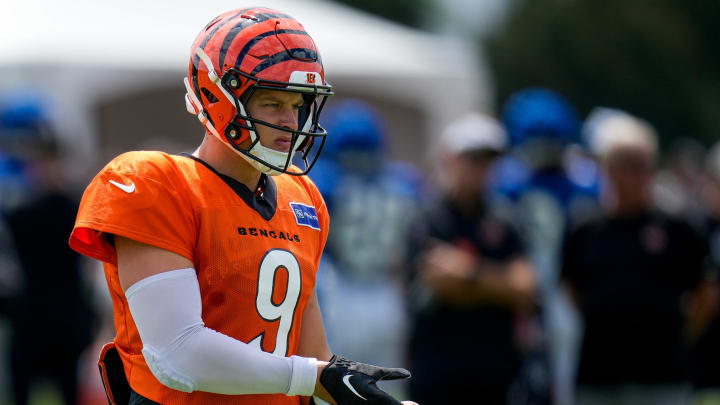 Cincinnati Bengals quarterback Joe Burrow (9) wears a black glove between reps during a preseason joint practice at the Paycor Stadium practice facility in downtown Cincinnati on Tuesday, Aug. 20, 2024.