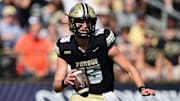 Purdue Boilermakers quarterback Ryan Browne (15) runs the ball