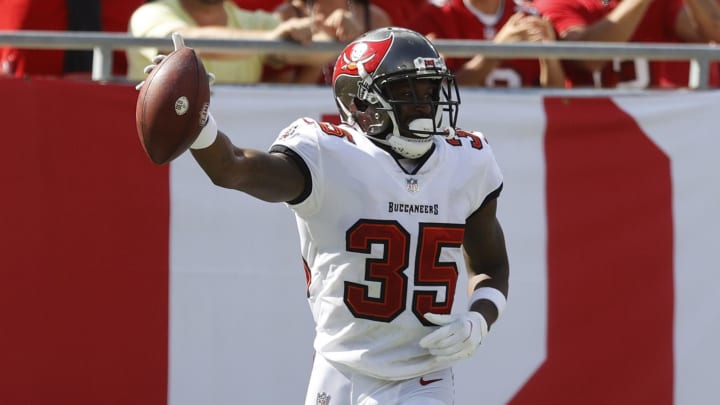 Oct 10, 2021; Tampa, Florida, USA; Tampa Bay Buccaneers cornerback Jamel Dean (35) intercepted the ball against the Miami Dolphins during the second half at Raymond James Stadium. Mandatory Credit: Kim Klement-USA TODAY Sports