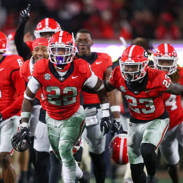 Nov 11, 2023; Athens, Georgia, USA; Georgia Bulldogs defensive back Javon Bullard (22) celebrates with teammates after an interception against the Mississippi Rebels in the second quarter at Sanford Stadium. Mandatory Credit: Brett Davis-USA TODAY Sports
