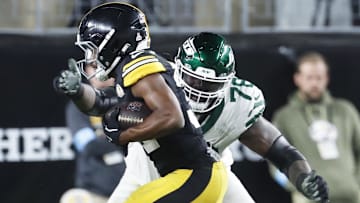 Oct 20, 2024; Pittsburgh, Pennsylvania, USA;  Pittsburgh Steelers cornerback Beanie Bishop Jr. (31) returns an interception against New York Jets offensive tackle Morgan Moses (78) during the third quarter at Acrisure Stadium. 