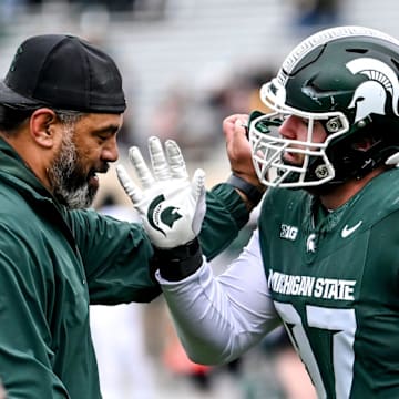 Michigan State's Maverick Hansen, right, works with defensive line coach Legi Suiaunoa during the Spring Showcase on Saturday, April 20, 2024, at Spartan Stadium in East Lansing.