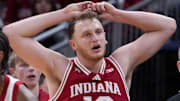 Indiana Hoosiers forward Tucker DeVries (12) reacts to a call against the Louisville Cardinals at Gainbridge Fieldhouse.