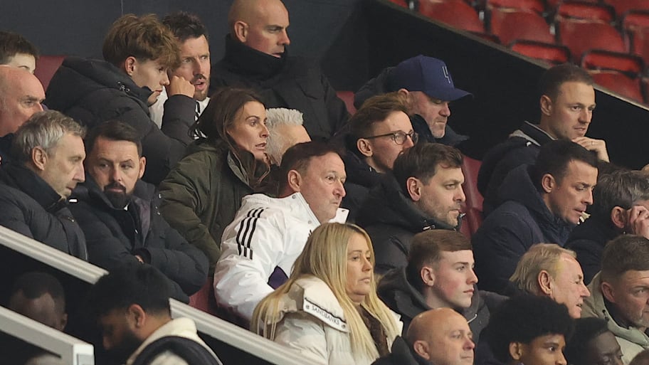 Wayne Rooney in a dark blue cap.