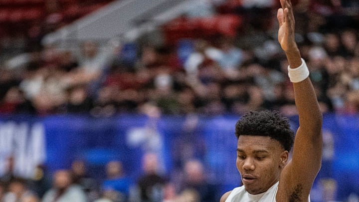 Santa Fe Catholic (1) Toby Lane drives by University Christian (2) King Sanders during the FHSAA 2A Boys State semifinal game at the RP Funding Center Thursday February 27, 2025 in Lakeland Fl. Santa Fe advances to the state final 71-50.
Ernst Peters/The Ledger