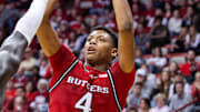 Jan 2, 2025; Bloomington, Indiana, USA; Rutgers Scarlet Knights guard Ace Bailey (4) shoots the ball while Indiana Hoosiers center Oumar Ballo (11) defends in the second half at Simon Skjodt Assembly Hall. Mandatory Credit: Trevor Ruszkowski-Imagn Images