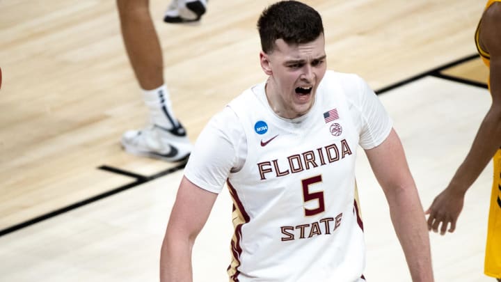 Florida State center Balsa Koprivica (5) celebrates after dunking the ball during their game against UNC Greensboro in the first round of the 2021 NCAA Tournament on Saturday, March 20, 2021, at Bankers Life Fieldhouse in Indianapolis, Ind. Mandatory Credit: Albert Cesare/IndyStar via USA TODAY Sports