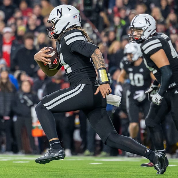 Nebraska quarterback TJ Lateef runs with the ball against USC.