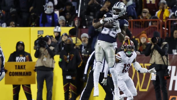 Jan 7, 2024; Landover, Maryland, USA; Dallas Cowboys wide receiver CeeDee Lamb (88) catches a pass in front of Washington Commanders cornerback Emmanuel Forbes (13) during the second quarter at FedExField. Mandatory Credit: Geoff Burke-USA TODAY Sports