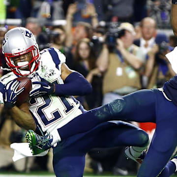 Feb 1, 2015; Glendale, AZ, USA; New England Patriots strong safety Malcolm Butler (21) intercepts a pass intended for Seattle Seahawks wide receiver Ricardo Lockette (83) in the fourth quarter in Super Bowl XLIX at University of Phoenix Stadium. Mandatory Credit: Mark J. Rebilas-Imagn Images