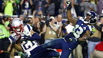 Feb 1, 2015; Glendale, AZ, USA; New England Patriots strong safety Malcolm Butler (21) intercepts a pass intended for Seattle Seahawks wide receiver Ricardo Lockette (83) in the fourth quarter in Super Bowl XLIX at University of Phoenix Stadium. Mandatory Credit: Mark J. Rebilas-Imagn Images