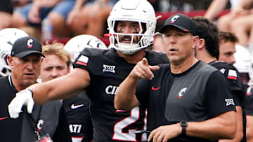 Cincinnati Bearcats head coach Scott Satterfield speaks with players during a NCAA men’s college football game between the Cincinnati Bearcats and Northwestern State Demons, Saturday, Sept. 13, 2025, at Nippert Stadium in Cincinnati.