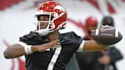 Arkansas Razorbacks quarterback KJ Jackson throws a pass during spring practice drills at the indoor practice center in Fayetteville, Ark.