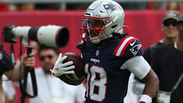 Nov 9, 2025; Tampa, Florida, USA; New England Patriots wide receiver Kyle Williams (18) runs for a touchdown during the second quarter against the Tampa Bay Buccaneers at Raymond James Stadium.