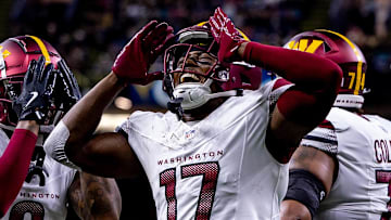 Dec 15, 2024; New Orleans, Louisiana, USA;  Washington Commanders wide receiver Terry McLaurin (17) reacts to scoring a touchdown against the New Orleans Saints during the first half at Caesars Superdome. Mandatory Credit: Stephen Lew-Imagn Images