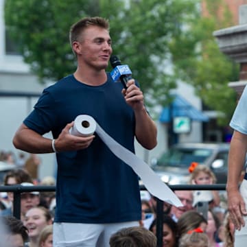Former Auburn quarterback Bo Nix shows Eli Manning the proper technique to throwing roll Toomers during the filming of the ESPN show Eli’s Places at Toomer’s Corner in Auburn, Ala. on Tuesday, July 8, 2025.