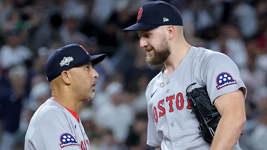 Boston Red Sox manager Alex Cora (13) shakes hands with starting pitcher Garrett Crochet in Game 1 of 2025 wild-card series.