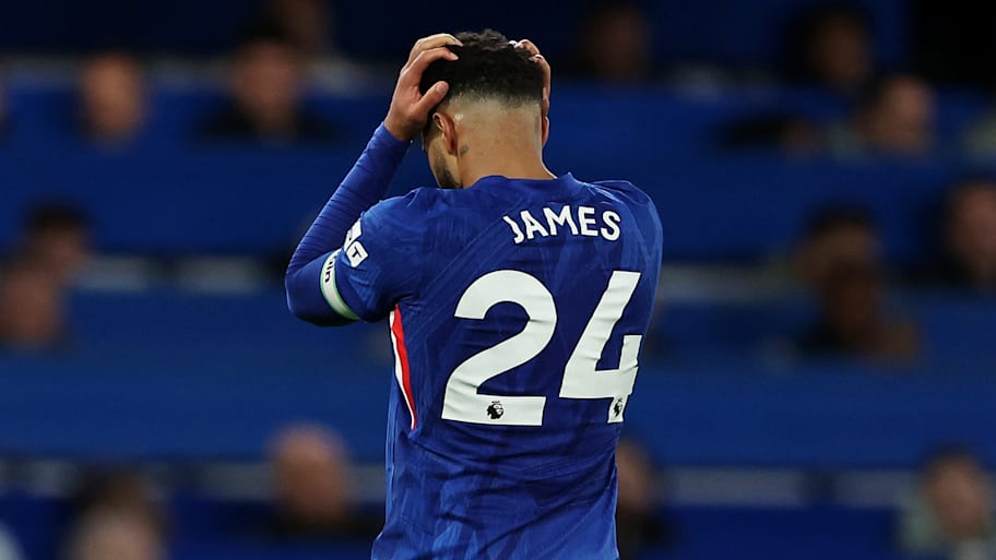 Reece James holds his head in disappointment