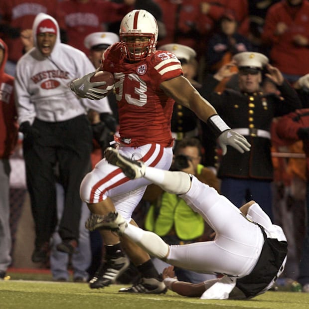 Ndamukong Suh brushes aside Colorado quarterback Cody Hawkins en route to a touchdown on an interception return in 2008.