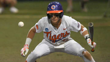 Jun 2, 2024; Clemson, South Carolina, USA; Clemson sophomore Cam Cannarella (10) watches a ball go by him on a pitch from Coastal Carolina University during the bottom of the eighth inning of the NCAA baseball Clemson Regional at Doug Kingsmore Stadium in Clemson. 