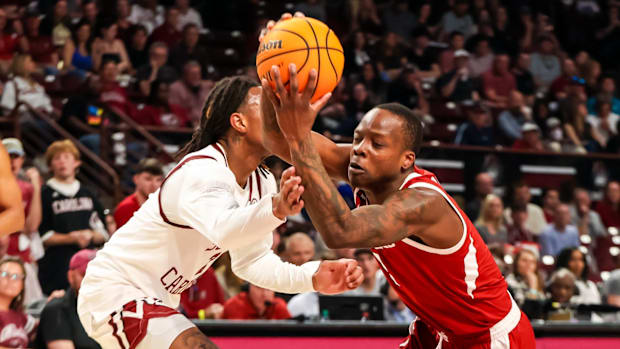 Arkansas Razorbacks Johnell Davis drives past defender