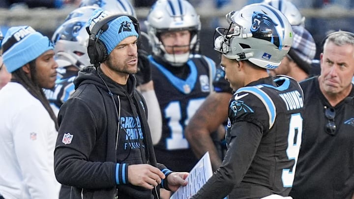 Dec 22, 2024; Charlotte, North Carolina, USA; Carolina Panthers head coach Dave Canales talks with quarterback Bryce Young (9) during a time out during the second half against the Arizona Cardinals at Bank of America Stadium. Mandatory Credit: Jim Dedmon-Imagn Images Dec 22, 2024; Charlotte, North Carolina, USA; Carolina Panthers head coach Dave Canales talks with quarterback Bryce Young (9) during a time out during the second half against the Arizona Cardinals at Bank of America Stadium. Mandatory Credit: Jim Dedmon-Imagn Images