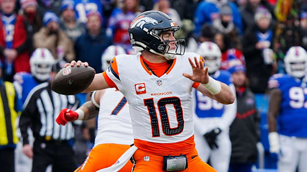 Denver Broncos quarterback Bo Nix (10) throws a. Pass during the first half of the Buffalo Bills wild card game against the D