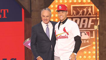 Jul 14, 2024; Ft. Worth, TX, USA;  JJ Wetherholt is congratulated by MLB commissioner Rob Manfred after being selected by the St. Louis Cardinals as the seventh player taken during the first round of the MLB Draft at Cowtown Coliseum. Mandatory Credit: Kevin Jairaj-Imagn Images