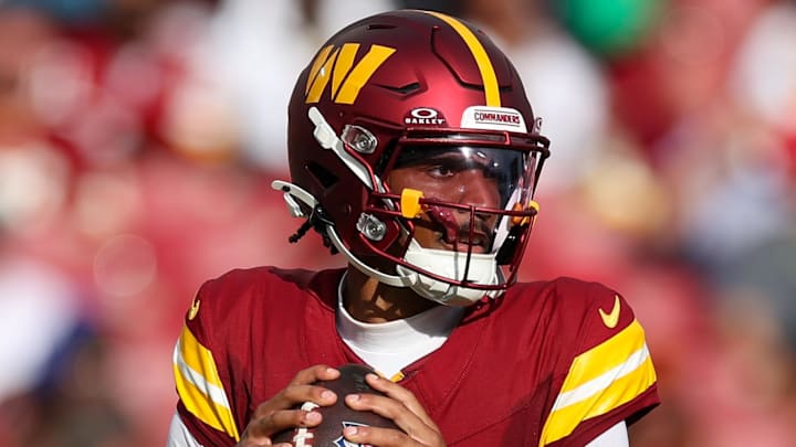 Sep 8, 2024; Tampa, Florida, USA; Washington Commanders quarterback Jayden Daniels (5) drops back to pass against the Tampa Bay Buccaneers in the third quarter at Raymond James Stadium. Mandatory Credit: Nathan Ray Seebeck-Imagn Images