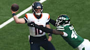 [US, Mexico & Canada customers only] Oct 12, 2025; Tottenham, UNITED KINGDOM;  Denver Broncos quarterback Bo Nix (10) is pressured by New York Jets linebacker Jamien Sherwood (44) during an NFL International Series game at Tottenham Hotspur Stadium. 